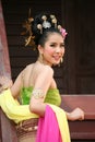 One woman in THAI RETRO DRESS is posing for a photograph.